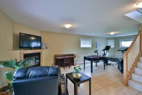 135 Riverbrook Close West, Lethbridge, AB - Indoor With Fireplace