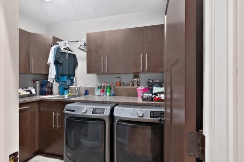 250 Riverstone Boulevard West, Lethbridge, AB - Indoor Photo Showing Laundry Room