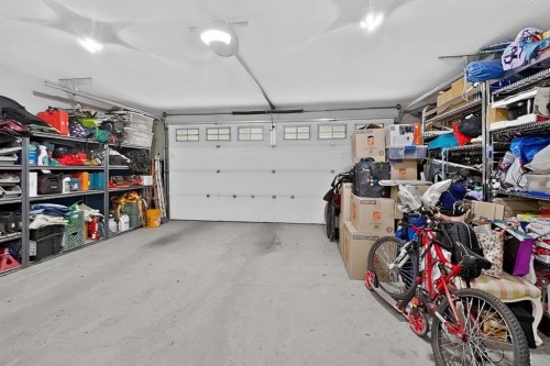 250 Riverstone Boulevard West, Lethbridge, AB - Indoor Photo Showing Garage