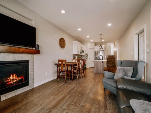 1369 Pacific Circle West, Lethbridge, AB - Indoor Photo Showing Living Room With Fireplace