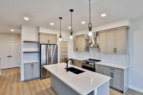 877 Devonia Circle West, Lethbridge, AB - Indoor Photo Showing Kitchen With Stainless Steel Kitchen With Double Sink With Upgraded Kitchen