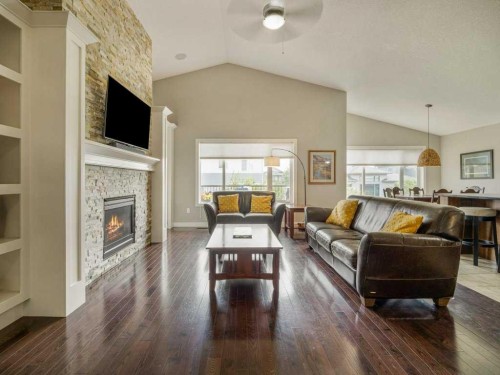 43 Riverine Lane West, Lethbridge, AB - Indoor Photo Showing Living Room With Fireplace