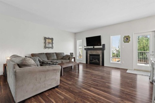 19 Riverland Close West, Lethbridge, AB - Indoor Photo Showing Living Room With Fireplace