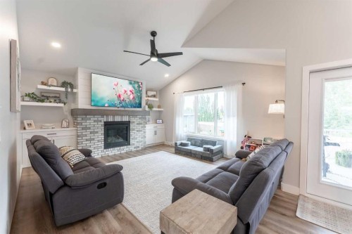 2006 30A Avenue, Coaldale, AB - Indoor Photo Showing Living Room With Fireplace