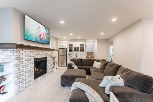 2006 30A Avenue, Coaldale, AB - Indoor Photo Showing Living Room With Fireplace