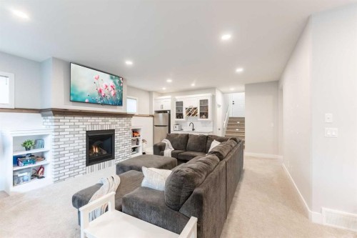 2006 30A Avenue, Coaldale, AB - Indoor Photo Showing Living Room With Fireplace