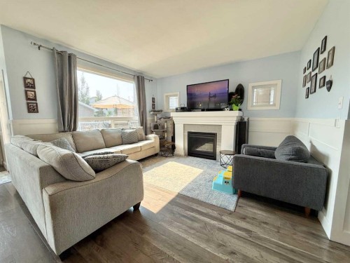 55 Riverhurst Cove West, Lethbridge, AB - Indoor Photo Showing Living Room With Fireplace