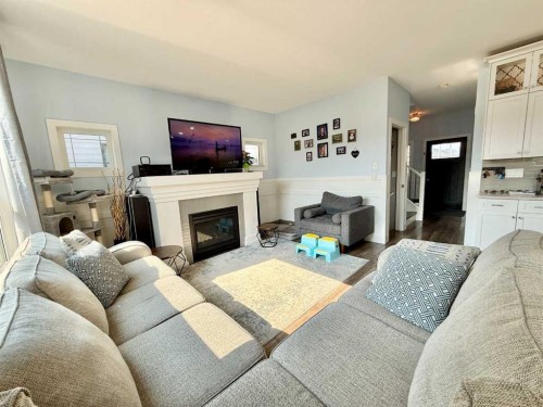 55 Riverhurst Cove West, Lethbridge, AB - Indoor Photo Showing Living Room With Fireplace