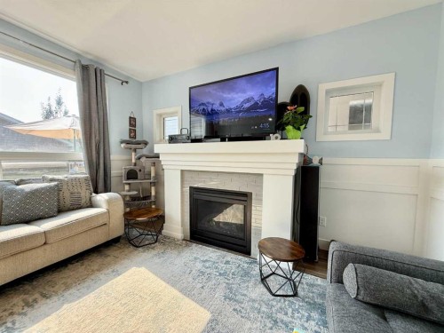 55 Riverhurst Cove West, Lethbridge, AB - Indoor Photo Showing Living Room With Fireplace