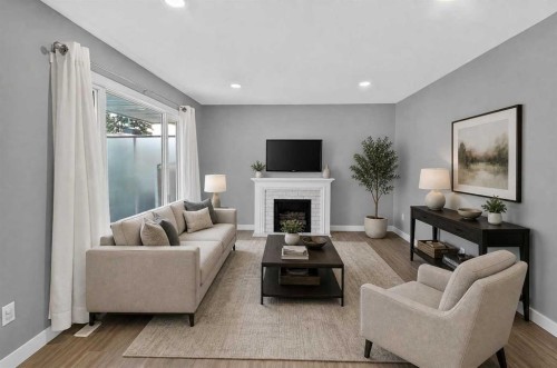 2110 15 Avenue South, Lethbridge, AB - Indoor Photo Showing Living Room With Fireplace