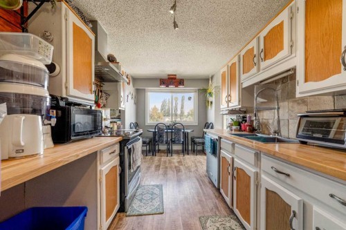 3921 Harmony Place, Taber, AB - Indoor Photo Showing Kitchen With Double Sink