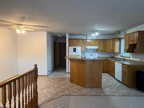 7A & 7B Pembina Road, Rainbow Lake, AB - Indoor Photo Showing Kitchen With Double Sink