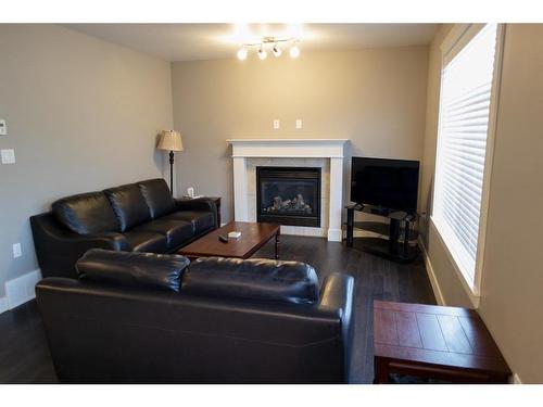 11322 105 Avenue, Grande Prairie, AB - Indoor Photo Showing Living Room With Fireplace
