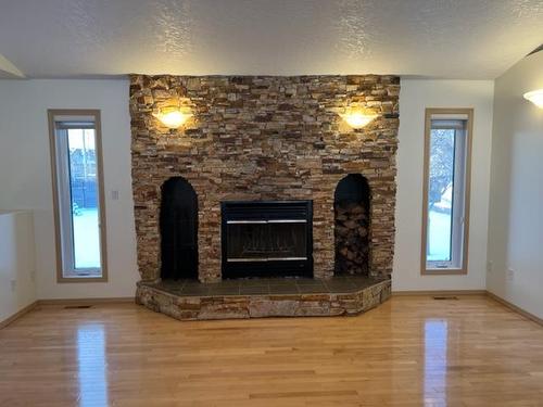 2 Chonkolay Drive, High Level, AB - Indoor Photo Showing Living Room With Fireplace