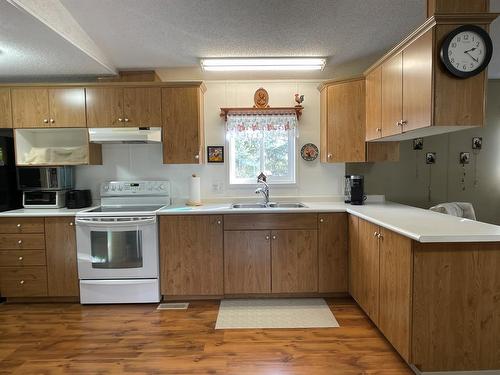 46 Peace River Avenue North, Joussard, AB - Indoor Photo Showing Kitchen With Double Sink