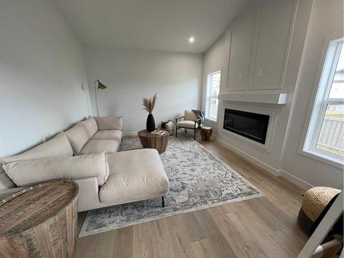 8557 72 Avenue, Grande Prairie, AB - Indoor Photo Showing Living Room With Fireplace
