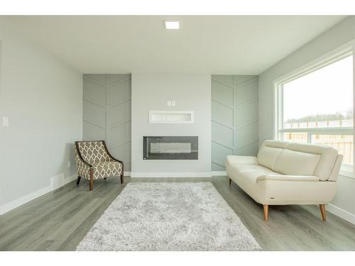 7818 91 Street, Grande Prairie, AB - Indoor Photo Showing Living Room With Fireplace