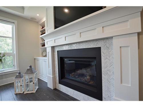 10201 67 Avenue, Grande Prairie, AB - Indoor Photo Showing Living Room With Fireplace