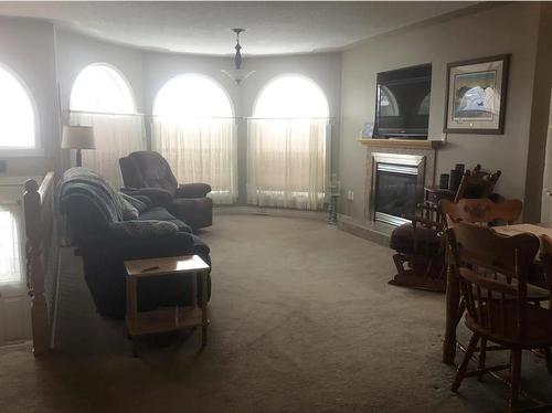 5510 45 Avenue, Grimshaw, AB - Indoor Photo Showing Living Room With Fireplace