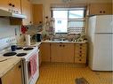 4413 53 Street, Grimshaw, AB  - Indoor Photo Showing Kitchen With Double Sink 