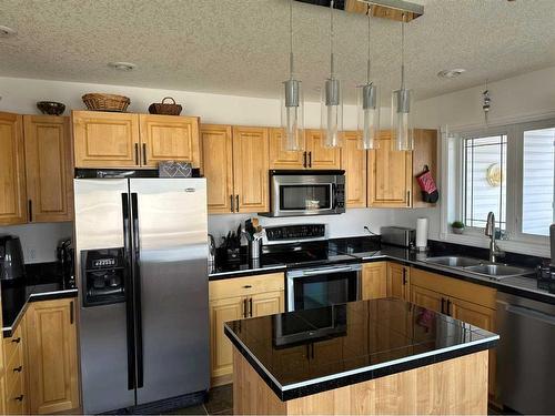50 Sunset Drive, Spirit River, AB - Indoor Photo Showing Kitchen With Stainless Steel Kitchen With Double Sink