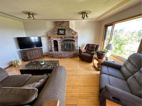 843A Township, Rural Northern Lights, County Of, AB - Indoor Photo Showing Living Room With Fireplace
