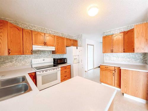 4535 46 Street, Rycroft, AB - Indoor Photo Showing Kitchen With Double Sink