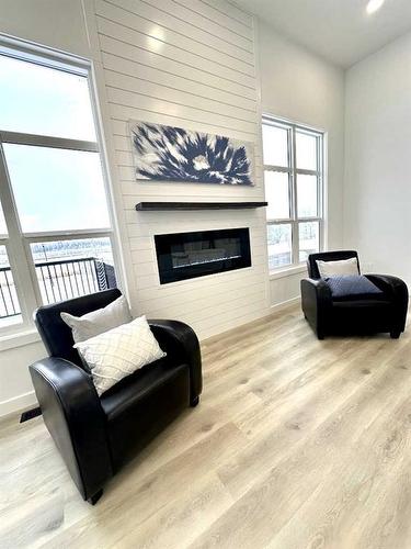 8817 59 Avenue, Grande Prairie, AB - Indoor Photo Showing Living Room With Fireplace