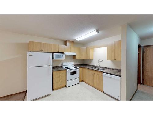 12015 Royal Oaks Drive, Grande Prairie, AB - Indoor Photo Showing Kitchen With Double Sink