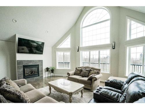 842007 Range Road 222, Rural Northern Lights, County Of, AB - Indoor Photo Showing Living Room With Fireplace