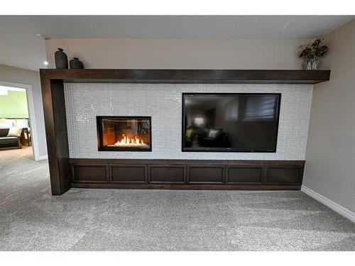 8218 Tamarack Trail, Rural Grande Prairie No. 1, County Of, AB - Indoor Photo Showing Living Room With Fireplace