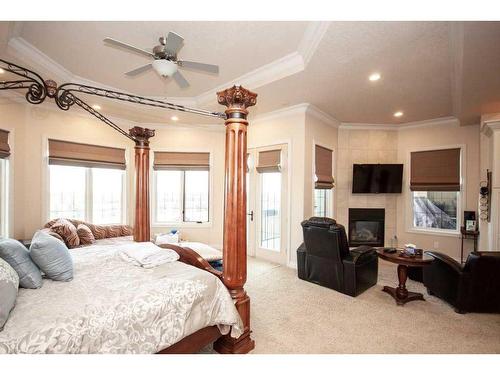 2-714040 Range Road 71, Grande Prairie, AB - Indoor Photo Showing Bedroom With Fireplace