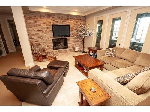 2-714040 Range Road 71, Grande Prairie, AB - Indoor Photo Showing Living Room With Fireplace