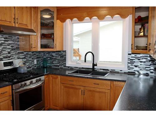 9705 75 Avenue, Peace River, AB - Indoor Photo Showing Kitchen With Double Sink