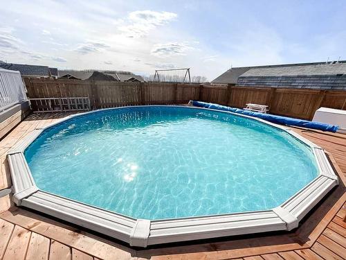9010 102 Street, La Crete, AB - Outdoor With Above Ground Pool With Backyard