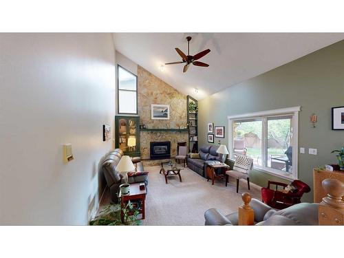 6102 96B Street, Grande Prairie, AB - Indoor Photo Showing Living Room With Fireplace