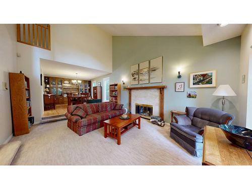 6102 96B Street, Grande Prairie, AB - Indoor Photo Showing Living Room With Fireplace