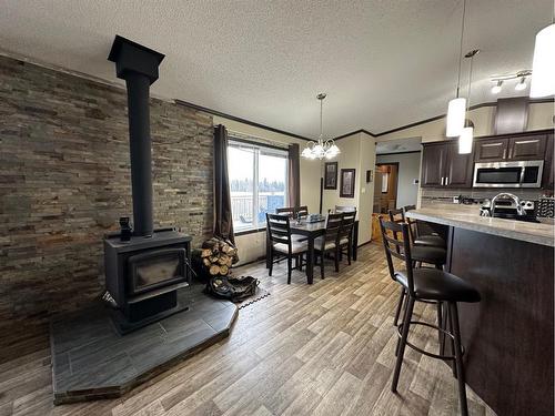5031 49 Avenue, Woking, AB - Indoor With Fireplace