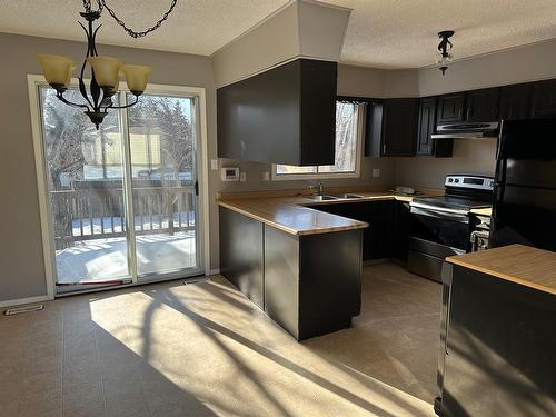 9415 84 Avenue, Peace River, AB - Indoor Photo Showing Kitchen With Double Sink