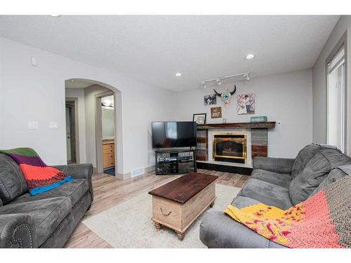 9302 62 Avenue, Grande Prairie, AB - Indoor Photo Showing Living Room With Fireplace