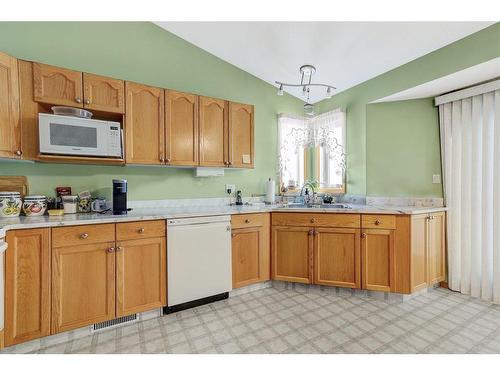 12413 Crystal Lake Drive, Grande Prairie, AB - Indoor Photo Showing Kitchen With Double Sink