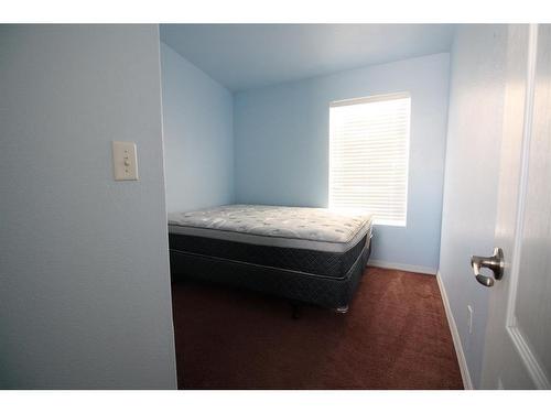 39 Deerglen Trailer Park, High Level, AB - Indoor Photo Showing Bedroom