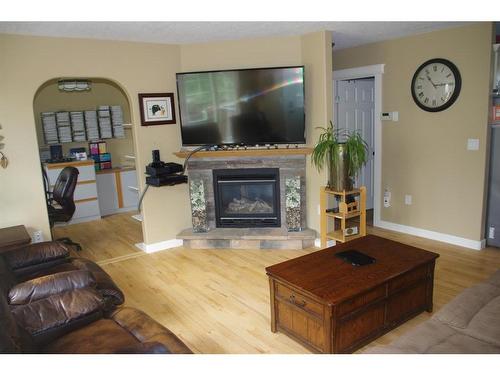 11301 100 Street, Fairview, AB - Indoor Photo Showing Living Room With Fireplace