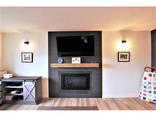 11310 62 Avenue, Grande Prairie, AB - Indoor Photo Showing Living Room With Fireplace