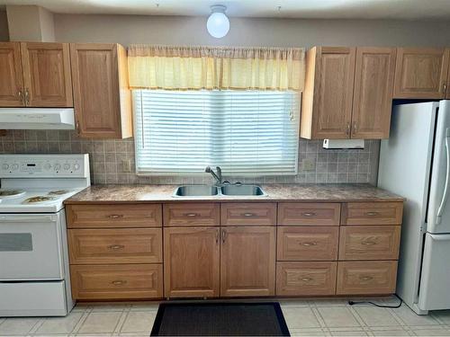 111 5Th Avenue S.W., Falher, AB - Indoor Photo Showing Kitchen With Double Sink
