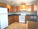 113-9105 91 Street, Grande Prairie, AB  - Indoor Photo Showing Kitchen With Double Sink 