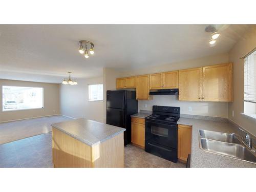 8202 & 8206 114 Street, Grande Prairie, AB - Indoor Photo Showing Kitchen With Double Sink