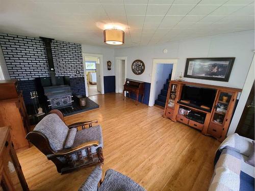 850070 743 Highway, Rural Northern Lights, County Of, AB - Indoor Photo Showing Living Room With Fireplace