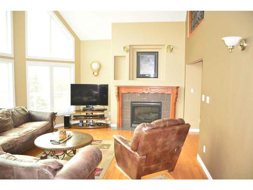 11201 67 Street, Peace River, AB - Indoor Photo Showing Living Room With Fireplace