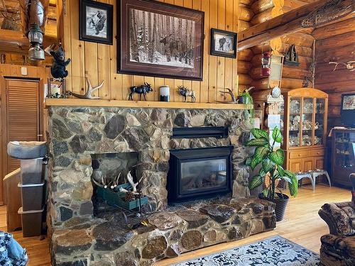 773012-54 Range Road, Rural Spirit River No. 133, M.D. Of, AB - Indoor Photo Showing Living Room With Fireplace